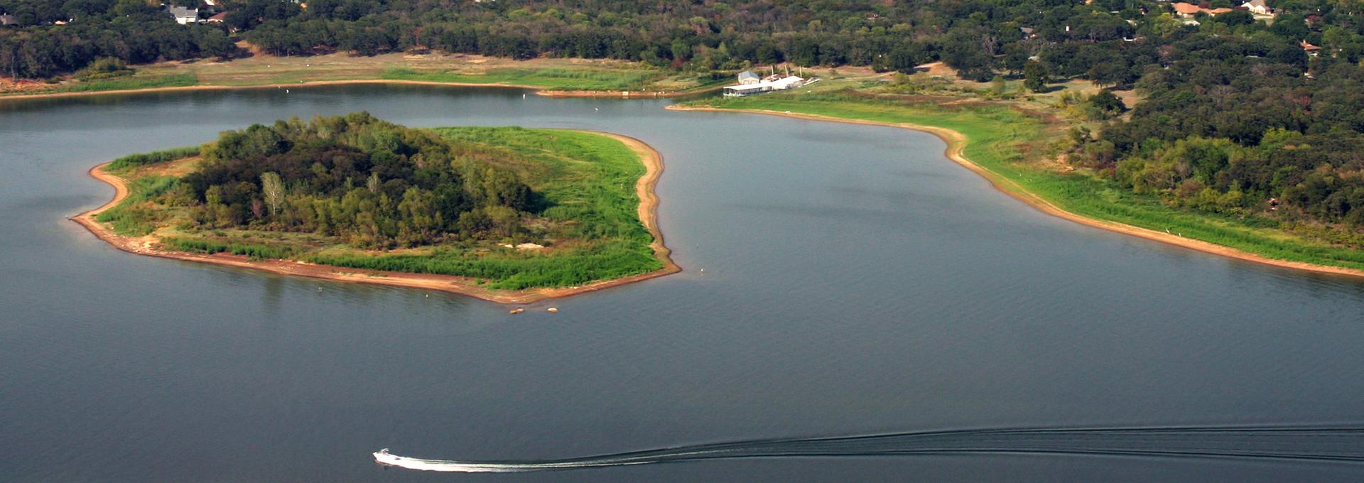 Aerial view of Lake Lewisville with a boat in the water