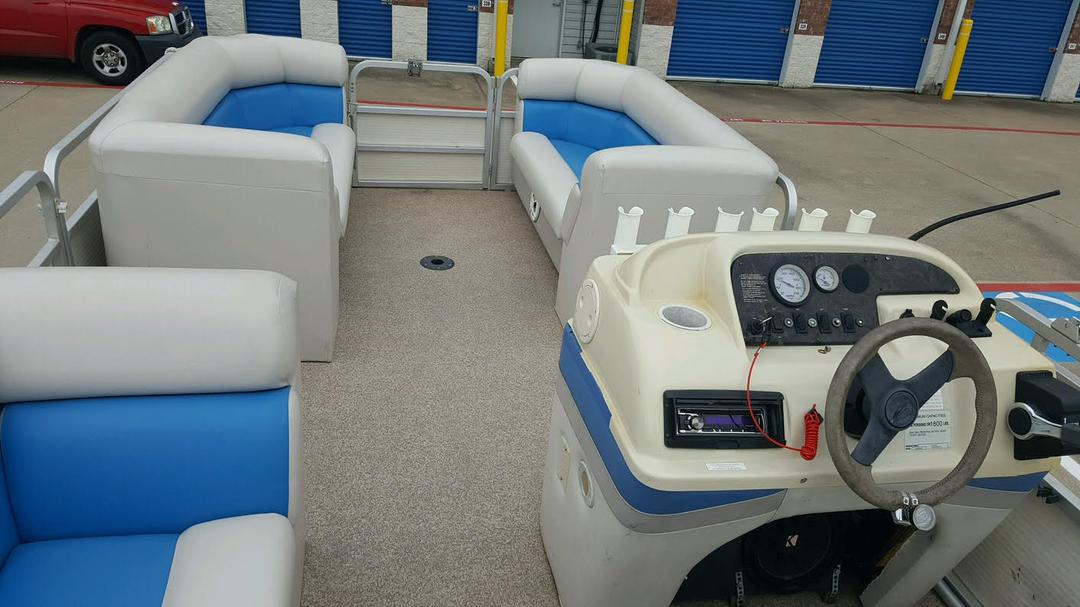 Front view of a blue pontoon boat rental at Lake Lewisville