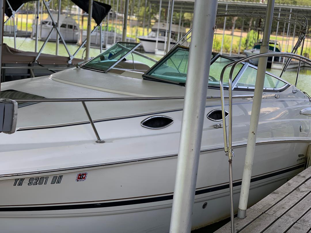 White mini yacht cruiser boat rental docked at Lake Lewisville