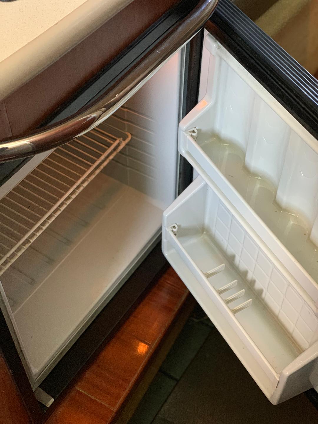 Fridge inside the white mini yacht cruiser boat rental at Lake Lewisville