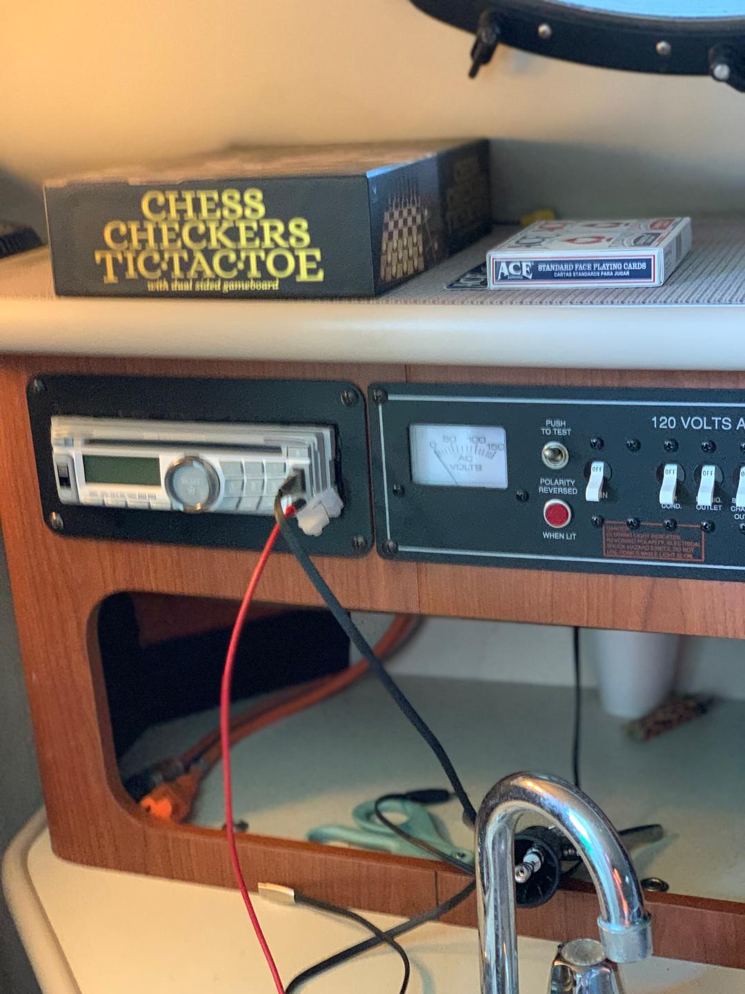 Radio inside the white mini yacht cruiser boat rental at Lake Lewisville