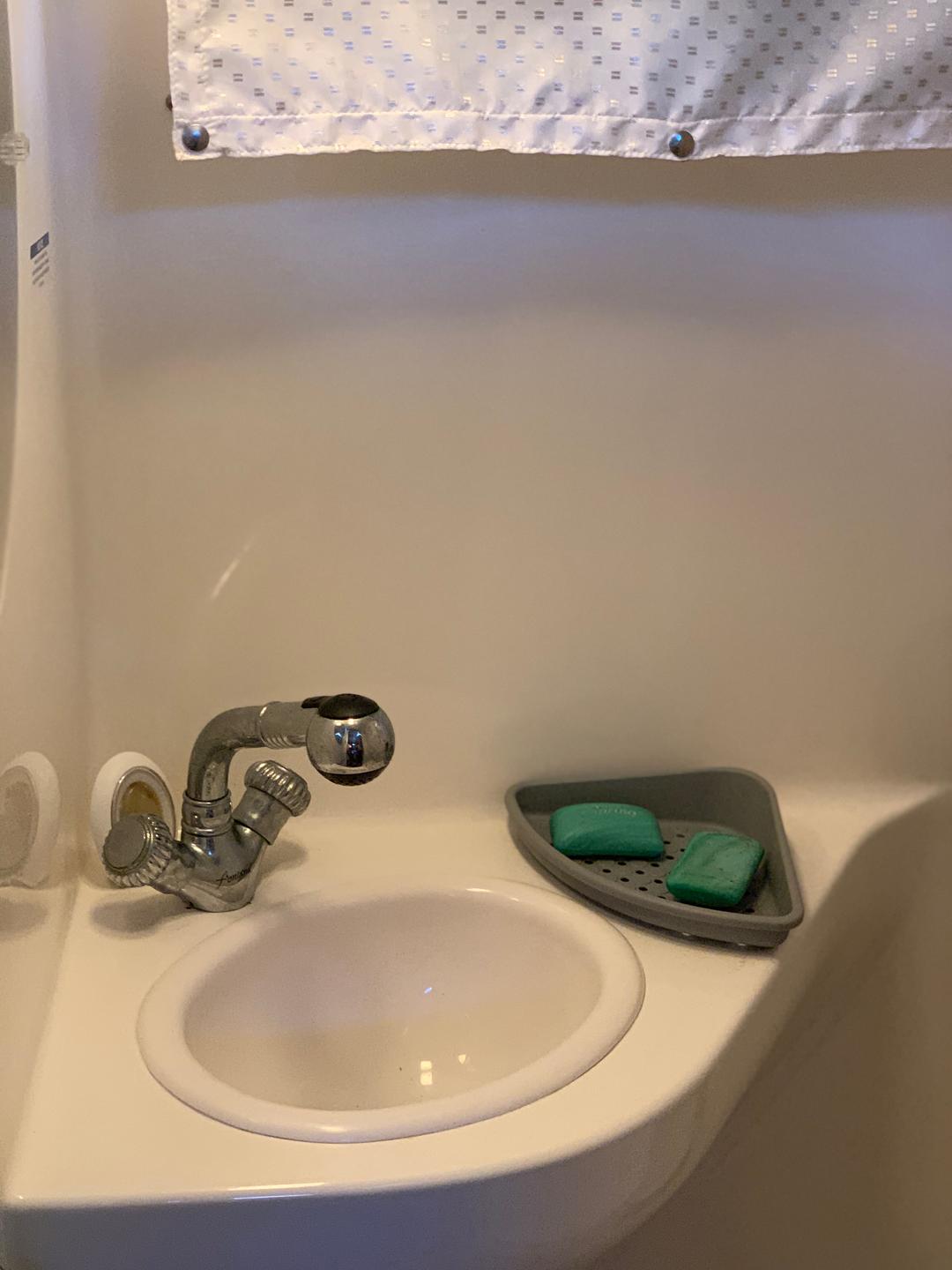 Sink setup in the white mini yacht cruiser boat rental at Lake Lewisville