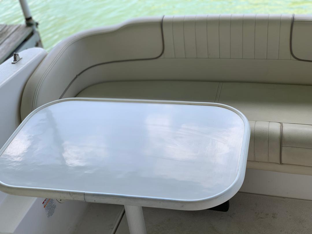 Table setup inside the white mini yacht cruiser boat rental at Lake Lewisville